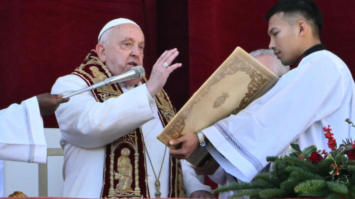 Pope Francis delivered his annual Urbi et Orbi message and blessing from the main balcony of St. Peter's basilica in the Vatican on December 25, 2024.