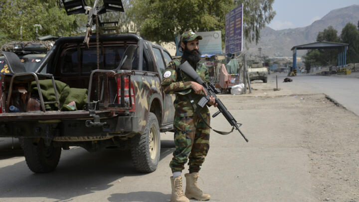 An Afghan Taliban soldier stands guard close to the Torkham border crossing with Pakistan, east of Kabul, on August 13, 2024.