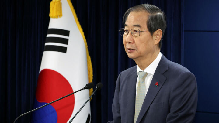 Prime Minister Han Duck-soo, South Korea's acting president, delivers an address to the nation in Seoul on December 14, 2024.